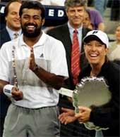 Lisa Raymond, right, and Leander Paes laugh during the trophy presentation 