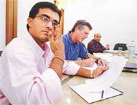 India's cricket captain Saurav Ganguly (L) attends a selectors meeting with Indian coach John Wright (C) in Mumbai.