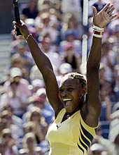 Serena Williams celebrates beating Martina Hingis at the US Open.--Reuters photo