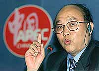 China's Finance Minister Xiang Huaicheng makes a point during a new conference following the 8th Asia-Pacific Economic Cooperation (APEC) Finance Ministers' Meeting in Suzhou on Sunday.