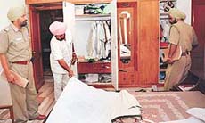 Policemen examine a room of the Sector 34 house of Mr K.K. Mahajan that was burgled on Saturday night, in Chandigarh on Sunday.
