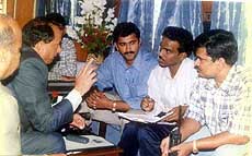CBI officials interrogating passengers.