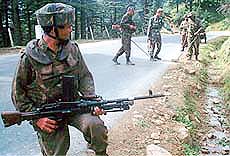 Indian soldiers look for landmines planted by separtist militants on a road in Jammu, winter capital of Jammu and Kashmir.