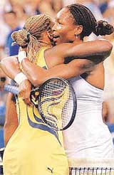 Venus Williams, right, hugs her sister, Serena