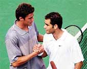 Marat Safin of Russia and Pete Sampras shake hands.