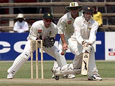 Zimbabwe batsman Andy Flower sweeps a delivery