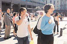 People react after one of the World Trade Center towers collapsed on Tuesday. 