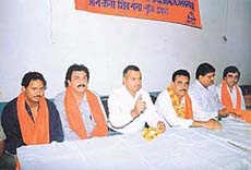Mr Ravinder Arora addresses Shiv Sena workers at a function in Ludhiana on Wednesday. 