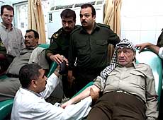 Palestinian President Yasser Arafat donates blood 