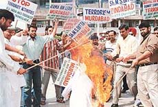 Members of the All-India Anti Terrorist Front burn the effigy of Osama bin Laden in protest against the attack on USA, in Chandigarh on Thursday. 