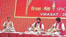 Pandit Vishwa Mohan Bhatt, his son Salil and Sandeep Das perform at the inaugural function of SPIC MACAY.