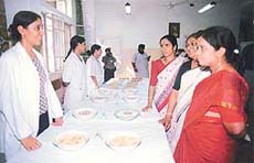 Visitors talk to diabetics students at the exhibition of sweet dishes for diabetics at Christian Medical College and Hospital in Ludhiana.