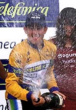 Spain's Oscar Sevilla sprays champagne after taking over the Tour of Spain.