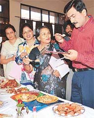Master chef Sanjeev Kapoor and the other judges taste the food at the Khana Khazana Cookery Contest in a Sector 24 hotel, Chandigarh, on Friday. 