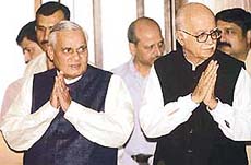 Mr Atal Behari Vajpayee and Mr L.K. Advani greet journalists before an all-party meeting in New Delhi on Saturday. 