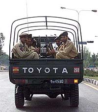 Pakistani soldiers patrol a highway leading to the Islamabad international airport in Islamabad on Saturday. 