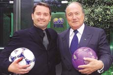 Yahoo! President Jeff Mallett (L) and FIFA President Joseph Blatter (R) pose outside the FIFA headquarters in Zurich.