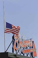 The American flag flies half staff over Turner Field in Atlanta, Georgia, on Saturday. 
