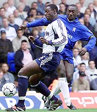 Chelsea FC's Jimmy Floyd Hasselbaink (R) tackles Tottenham Hotspur's Ledley King during the English premier league game at White Hart Lane, London, on Sunday. 