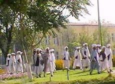 Afghan clerics, seen in this video grab, arrive at a meeting in Kabul on Wednesday to decide whether to bow to international demands for the surrender of Osama bin Laden.