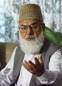 Qazi Hussein Ahmed, head of Pakistan's largest Islamic party Jamaat-e-Islami, gestures during a news conference in Islamabad on Thursday.