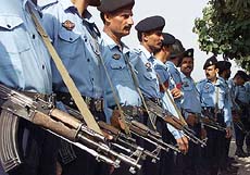 Pakistani police officers stand guard