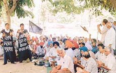 Employees of various nagar councils and municipal committees of Punjab hold a demonstration in protest against the abolition of octroi, in Ludhiana on Thursday. 