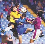 Aston Villa's Darius Vassell, left, puts Croatia's, NK Varteks' goalkeeper Danijel Madaric under pressure during the UEFA Cup