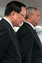 Secretary of State Colin Powell, right, and Chinese Foreign Minister Tang Jiaxuan prepare to meet reporters outside the State Department in Washington on Friday after their meeting. 