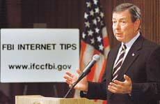 U.S. Attorney General John Ashcroft speaks to the press at the FBI building in Washington Ashcroft introduced the new interim rules on custody procedures for the Immigration and Naturalisation Services.