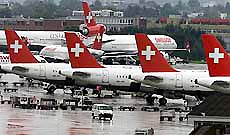 Swissair planes sit on the tarmac at Zurich-Kloten airport on Monday. Troubled aviation conglomerate Swissair Group announced plans for massive job cuts of at least 3,000.
