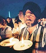 Arvinder Singh, from Silver Spring, joins in an inter-faith memorial service at the Lincoln Memorial on Sunday in Washington.