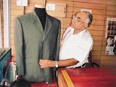 Tough times ahead: A tailor with his creation.