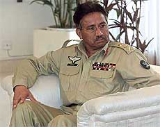 Pakistan's President General Pervez Musharraf listens to his guests, Belgian Foreign Minister Louis Michel