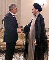 Iranian President Mohammad Khatami, right, shakes hands with British Foreign Minister, Jack Straw during an official meeting in Tehran on Tuesday.