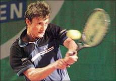 Juan Carlos Ferrero of Spain hits a return during his first round match against Paradorn Srichaphan of Thailand in the Hong Kong Open 2001 tennis tournament on Wednesday. 