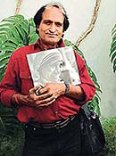 Ace photographer Raghu Rai with a photograph of Mother Teresa.