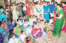 The Principal of the Dev Samaj College for Women, Sector 45, Ms Vimal Bhargav, interacts with residents of Burail as part of the ongoing NSS camp on the colleges premises on Friday.