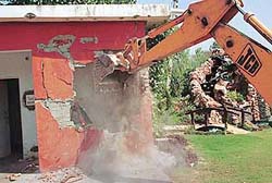 One of the 13 farmhouses that was demolished by the Panchkula administration in Kot Billa village near Barwala on Friday. 