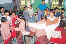 Slum children of Aashiana School, Sector 24, happy after receiving packets of clothes in Government High School, Sector 29. 