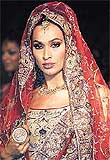 A model wears a traditional Indian bridal garment during the Bridal Asia 2001 fashion show
