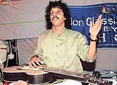 Subhash Ghosh performs at the Sukhna Lake in Chandigarh on Sunday. 