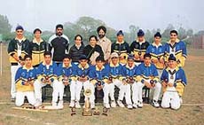 The under-16 cricket team of the St Johns High School, Sector 26, which won the challenger trophy, along with their principal, Ms P. Cheema, and coach.