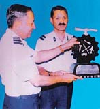 The Air Officer Commanding, 3 BRD, Air Cmde S B Prashar (right), receives the best aircraft base repair depot trophy from Air Officer Commanding-in-Chief, Maintenance Command, Air Marshal S.S. Gupta