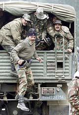 A jawan jumps out of a truck
