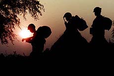 Indian BSF men conduct a patrol