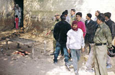 Cops examining the site where Deepak was shot dead.