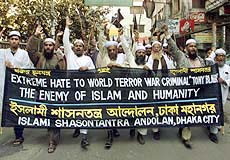Bangladesh Islamic activists shout slogans during a protest in Dhaka on Thursday just before the visit of British Prime Minister Tony Blair.