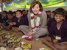 Cherie Blair, wife of Britains Prime Minister Tony Blair, joins the children of Christel House for lunch in Bangalore on Saturday. 