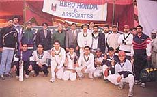 The Sumit Dogra Academy team with chief guest Anil Jain and president of Friends Club Jitender Yadav after they lifted the Friends Club Cricket Tournament title at Dharu Hera.